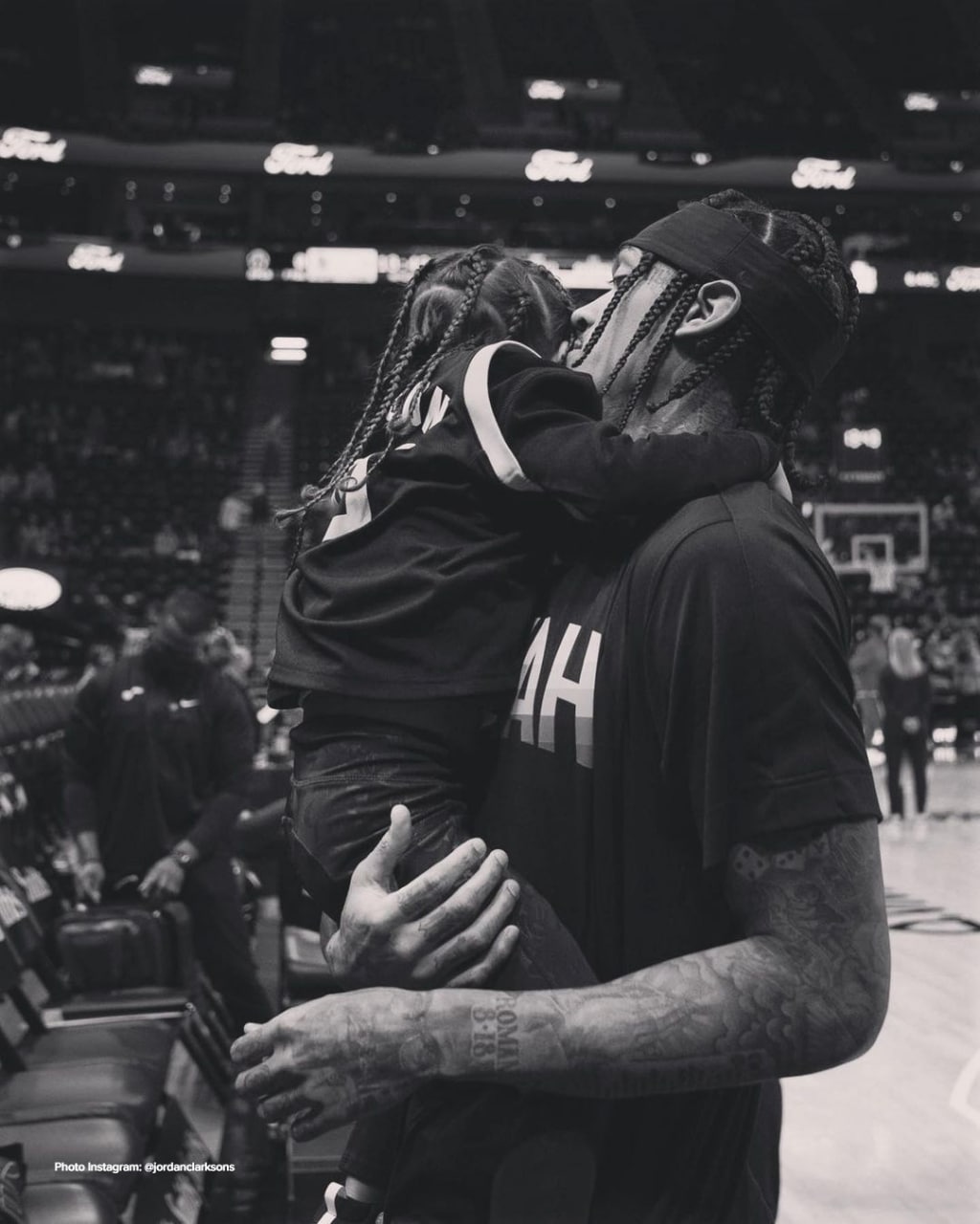 Jordan Clarkson carrying his daughter Cali before an NBA game