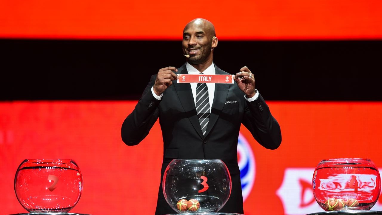 Kobe Bryant, World Cup Ambassador shows a ticket of Italy during the draw ceremony of 2019 FIBA Basketball World Cup in Shenzhen