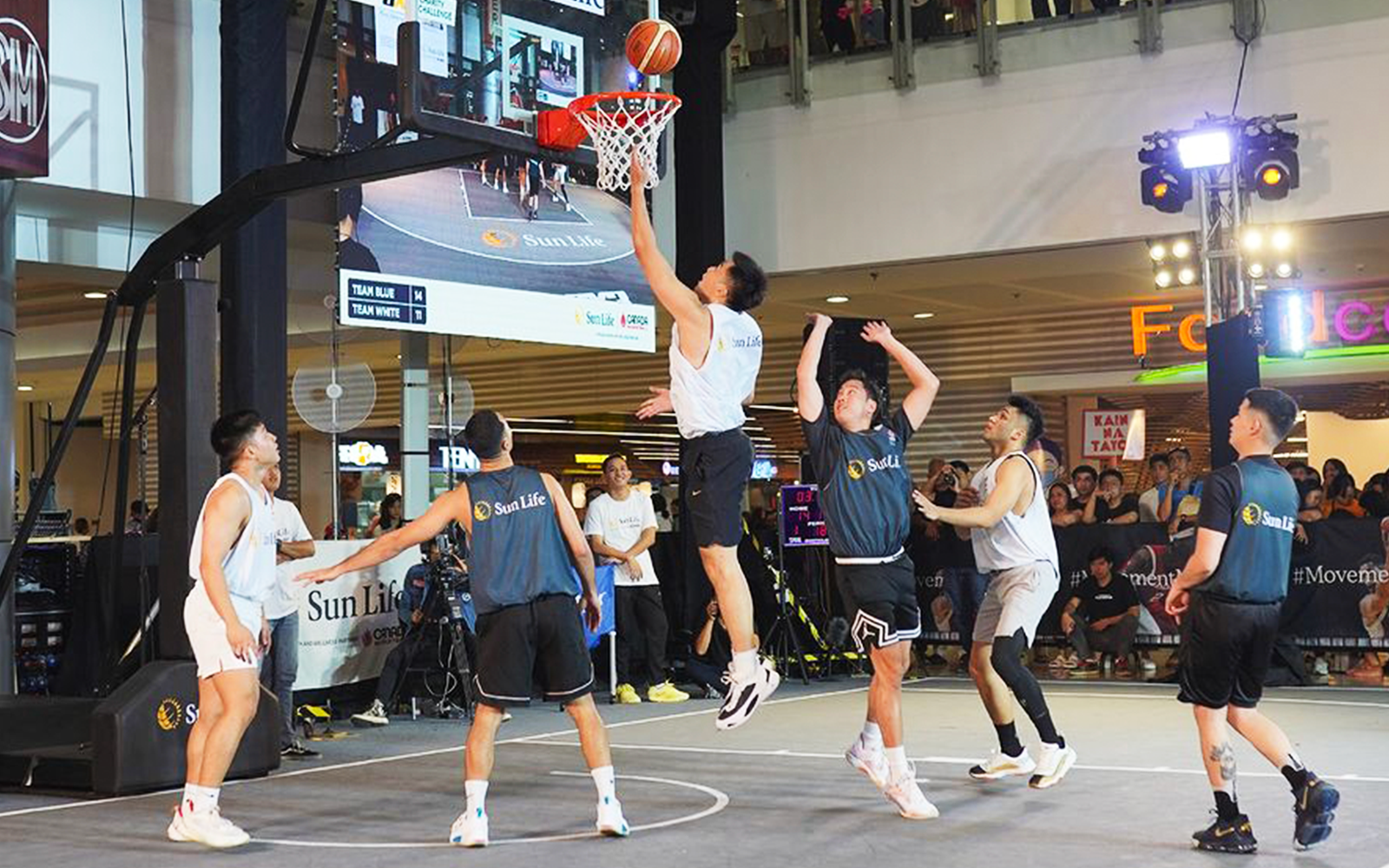 League pros and celebrity players in action during the Sun Life 3x3 Charity Challenge