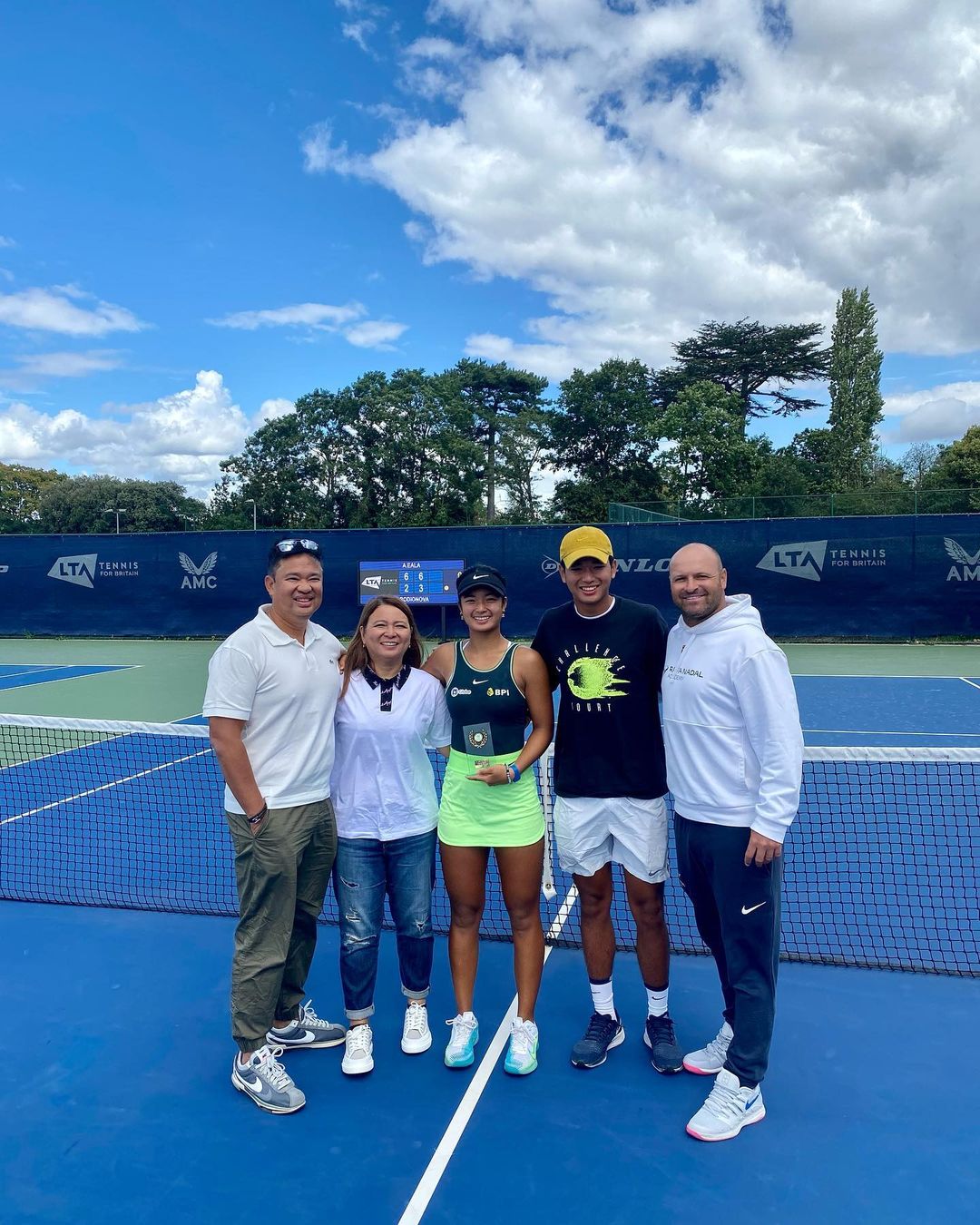 Alex Eala with her family after her W25 Roehampton victory. 