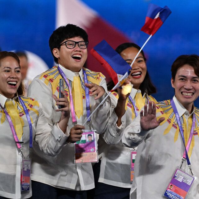 Filipino athletes wearing Puey Quinones' Barong Tagalog designed for Team Philippines for the 19th Asian Games