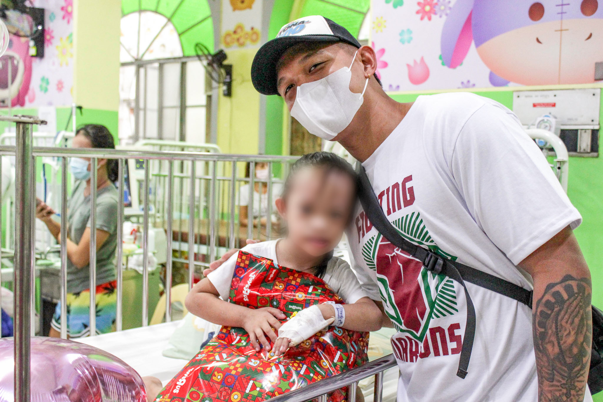 UP Fighting Maroons celebrate the holidays by giving toys to the UP-PGH kids