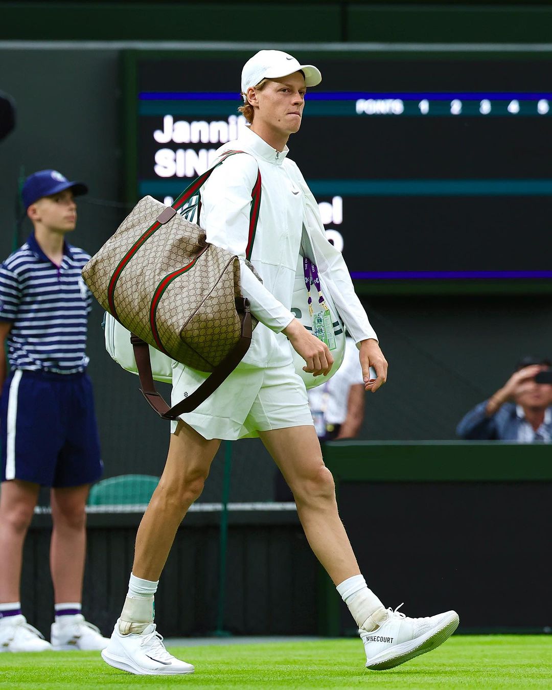 Jannik Sinner carrying his custom Gucci duffel bag in the 2023 Wimbledon Championships