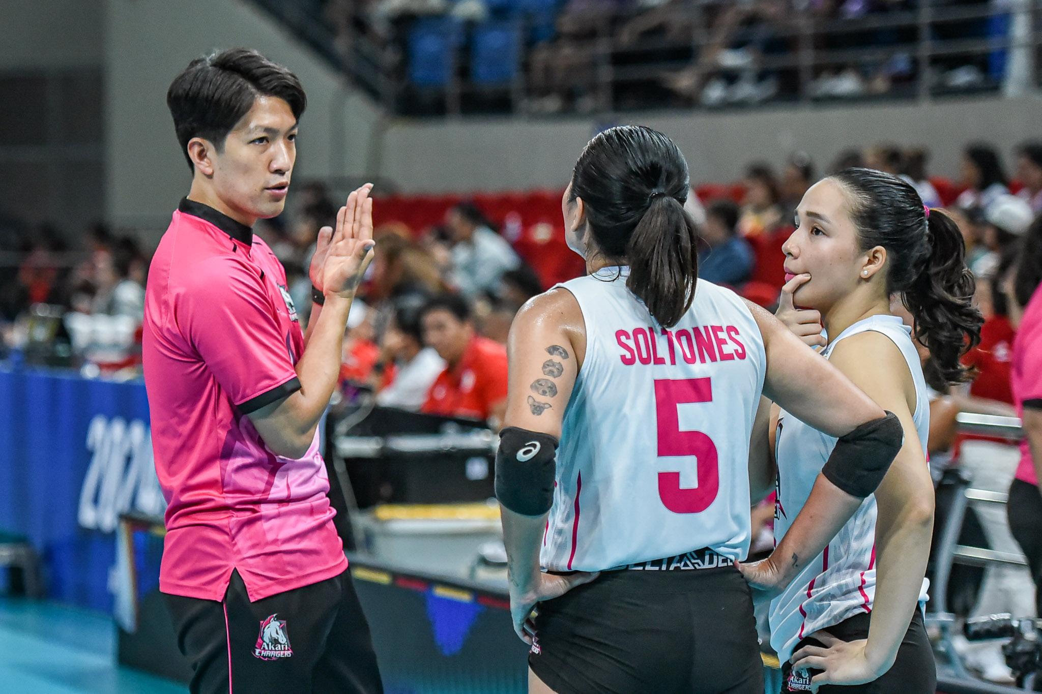 Coach Taka in conversation with Gretchel Soltones and Cobb.