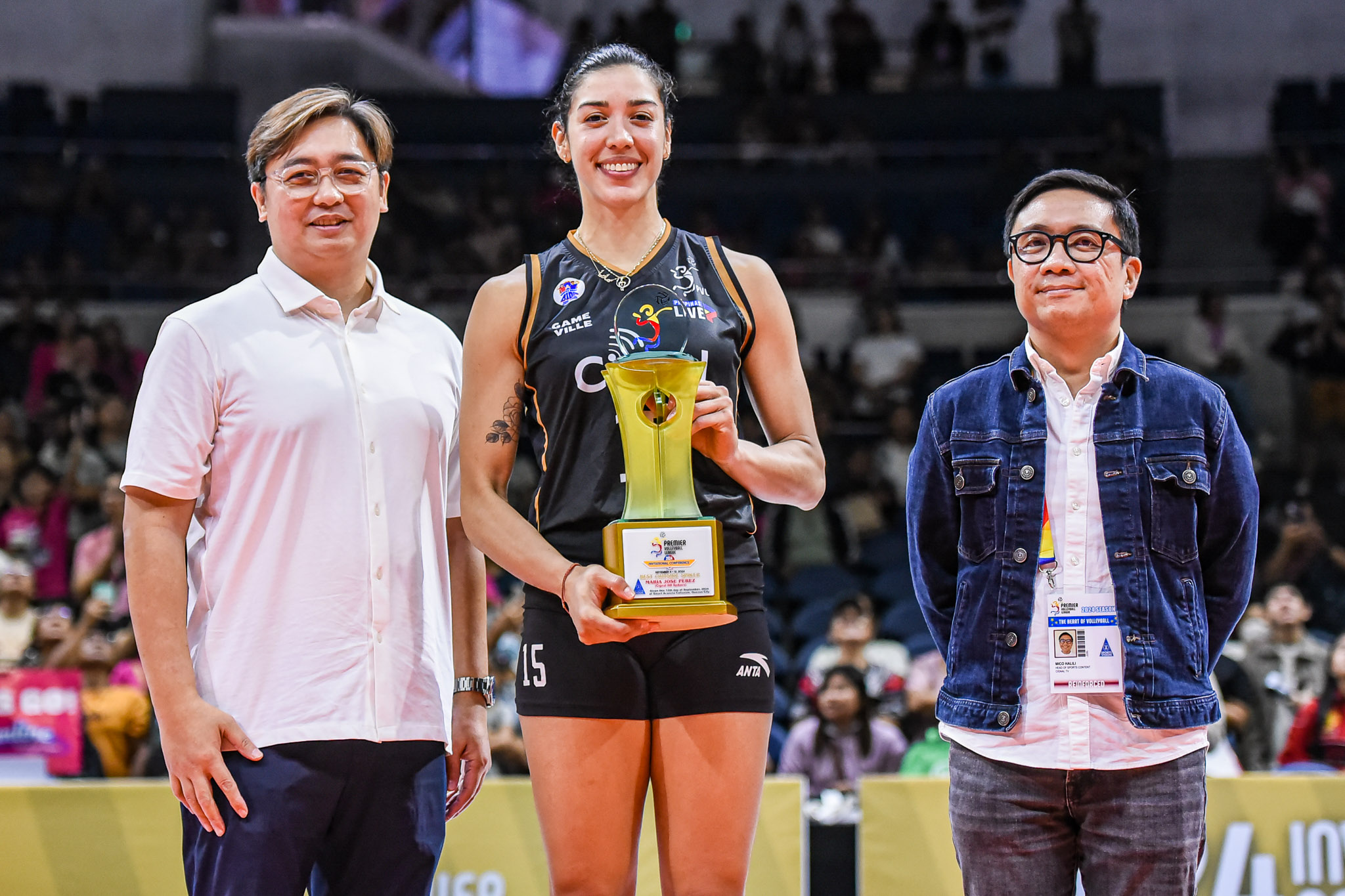 MJ Perez with her Best Outside Spiker Award