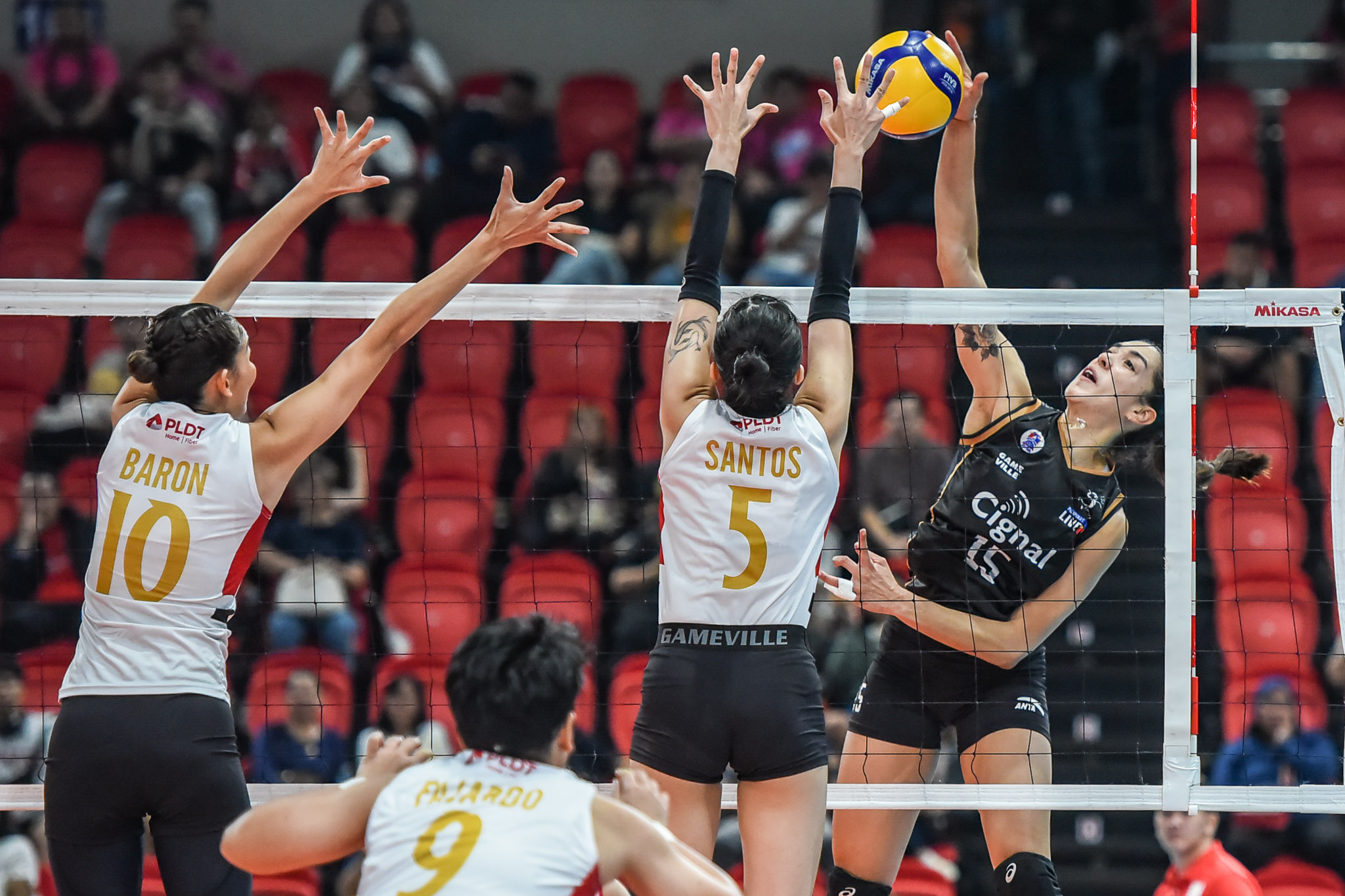 A shot of Cignal's MJ Perez going up for a spike against PLDT