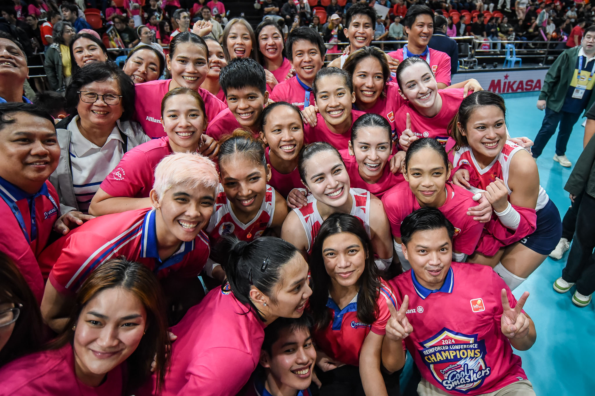 A team photo of Creamline after the Finals