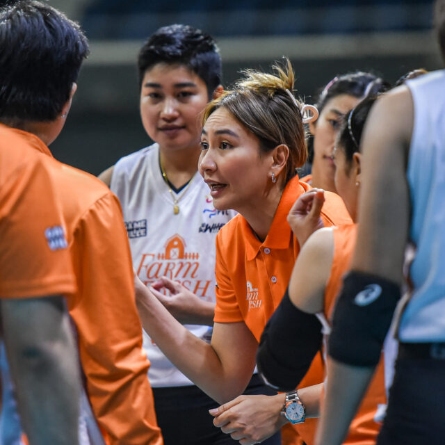 A photo of Rachel Anne Daquis coaching her Farm Fresh teammates