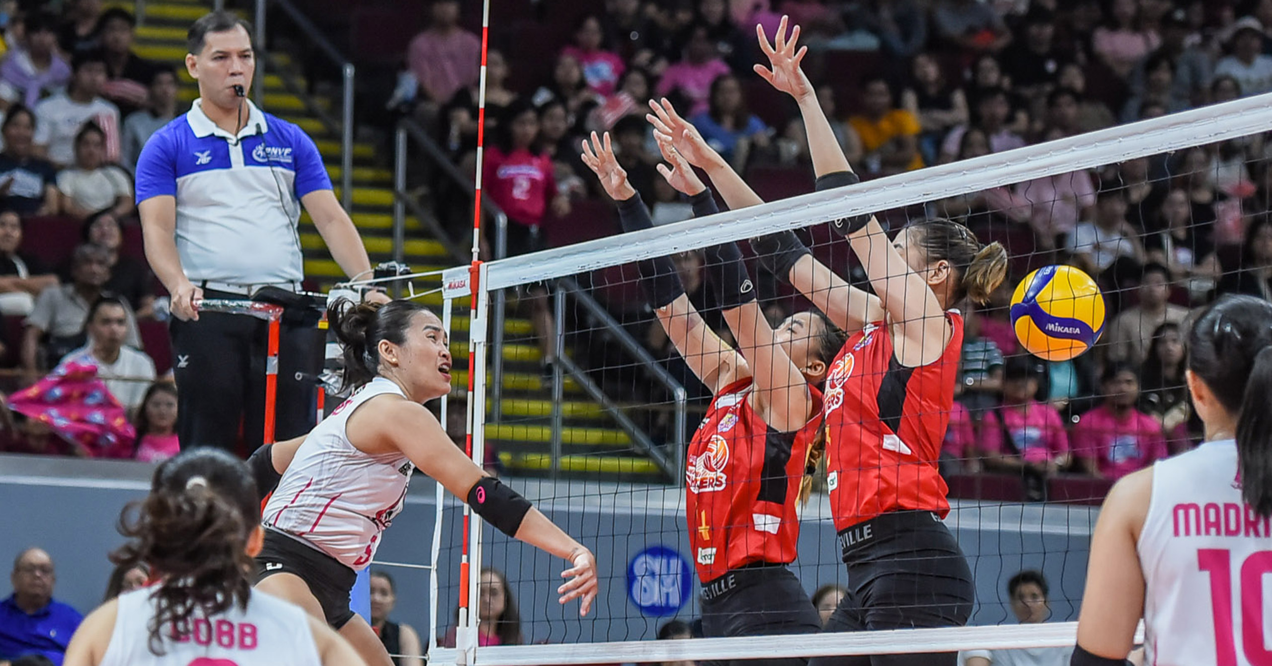 A shot of Akari spiker Grethcel Soltones against PLDT's Fiola Ceballos and Mika Reyes