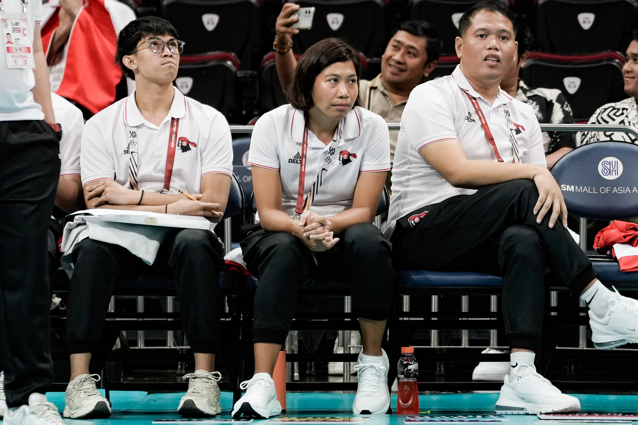 Rhea Dimaculangan with her elder brother Ronwald on the UE Red Warriors' bench