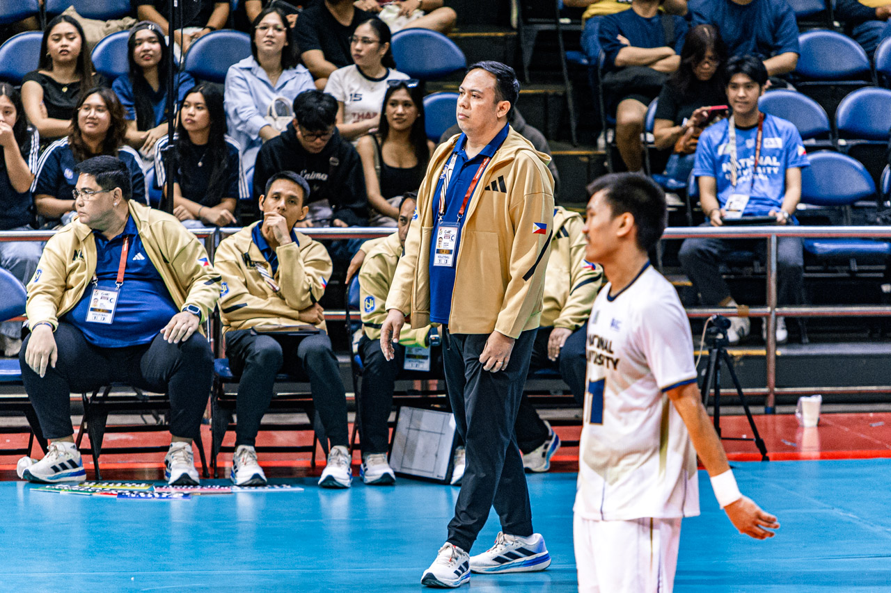 Uaap 87 mvb nu v ust - dante alinsunurin - the game Dante Alinsunurin in his coaching duties with the NU Bulldogs.
