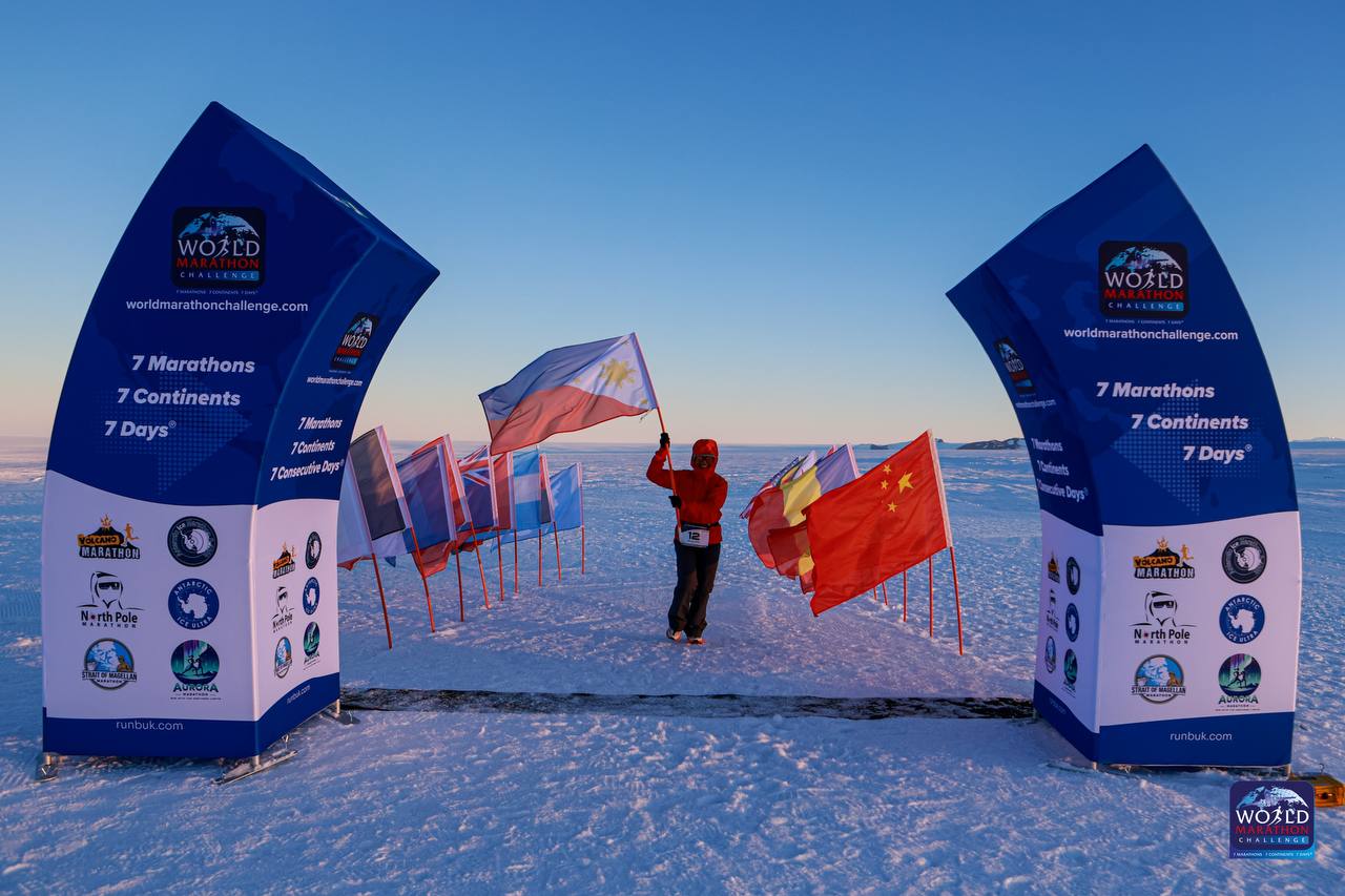 Wmc mench ph - the game Mench Dizon proudly raises the Philippine flag in Antarctica at the first leg of the World Marathon Challenge